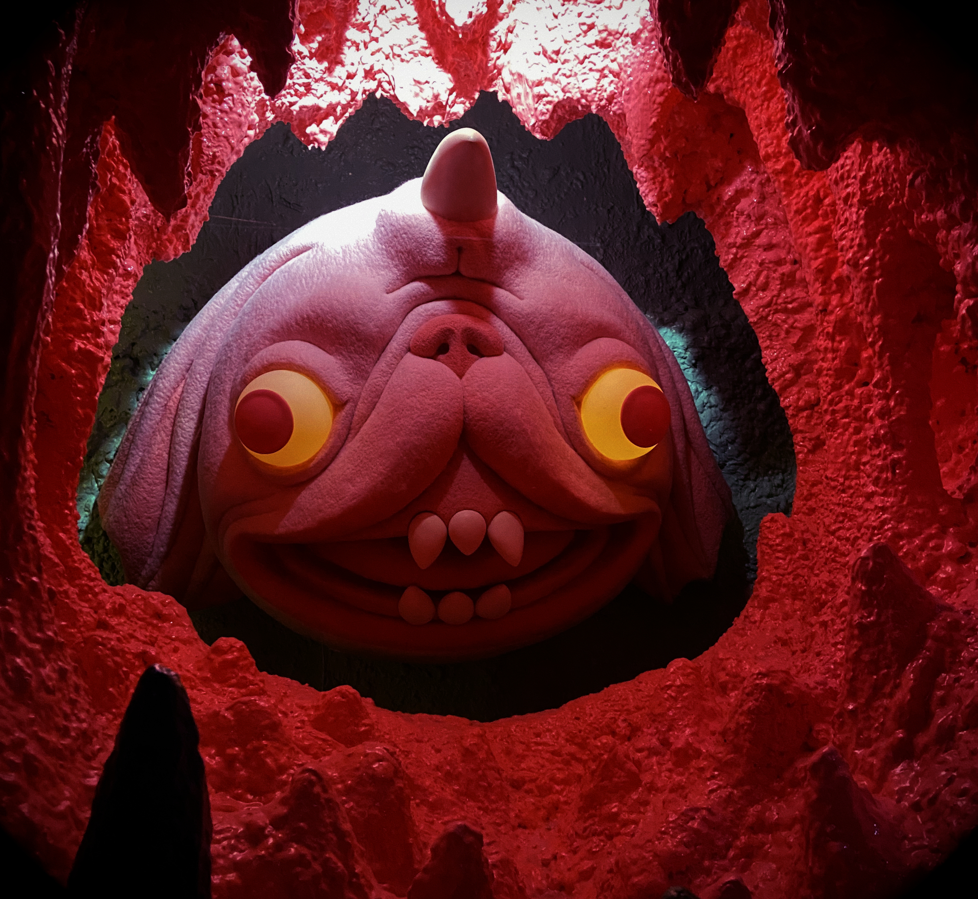 surreal face of a horned animal that resembles a pug and a rabbit